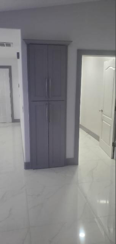 There is a closet in the middle of the room.