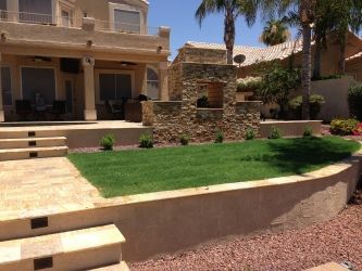 A large house with a lush green lawn in front of it