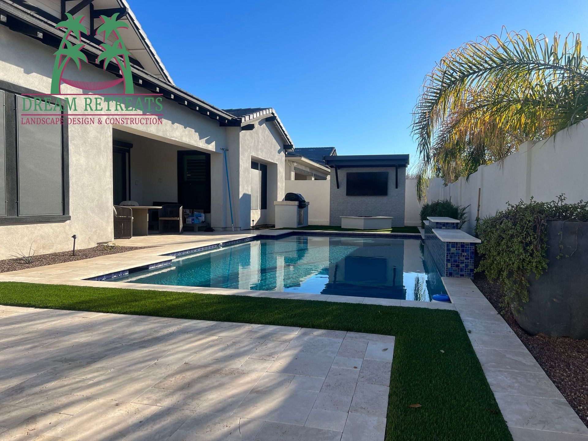 A large swimming pool in the backyard of a house