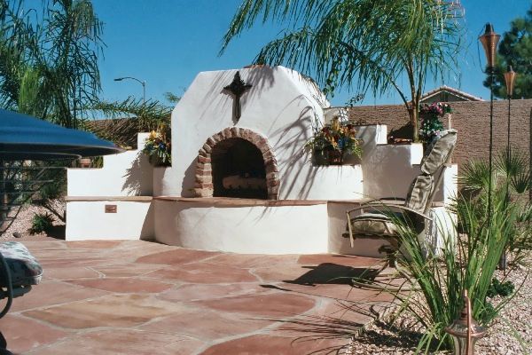 A white building with a cross on top of it