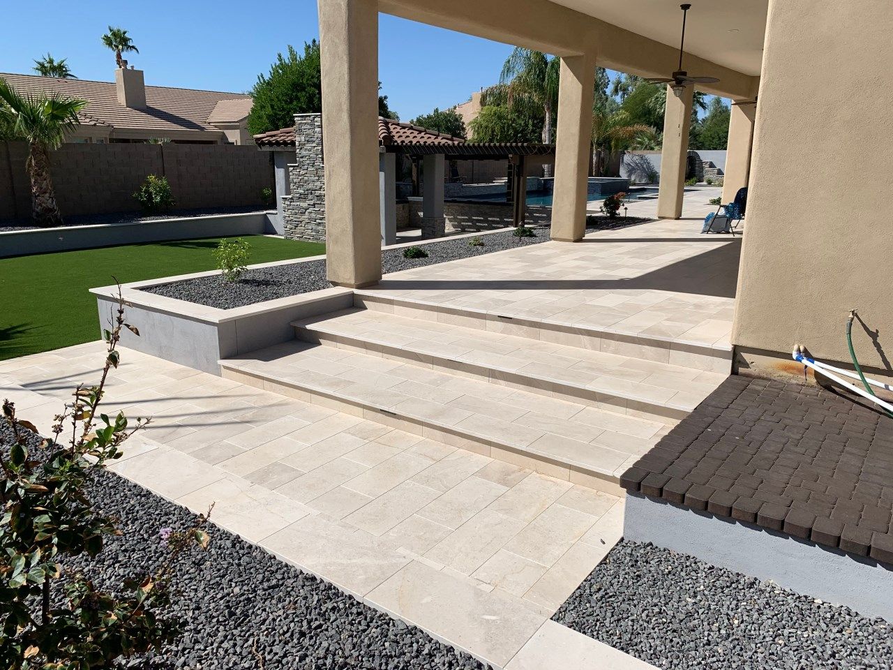 A house with a patio and stairs leading up to it
