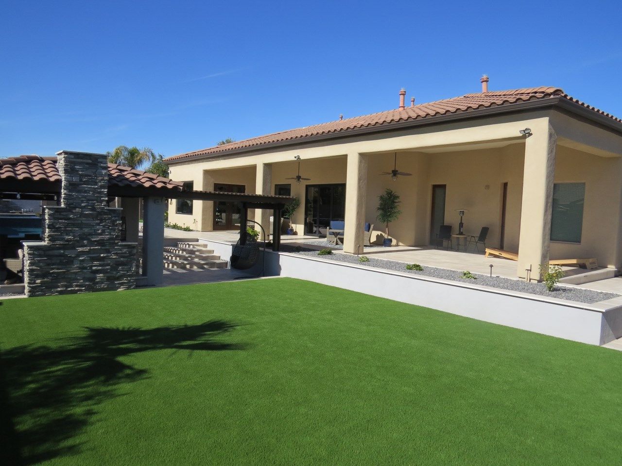 A large house with a large lawn in front of it