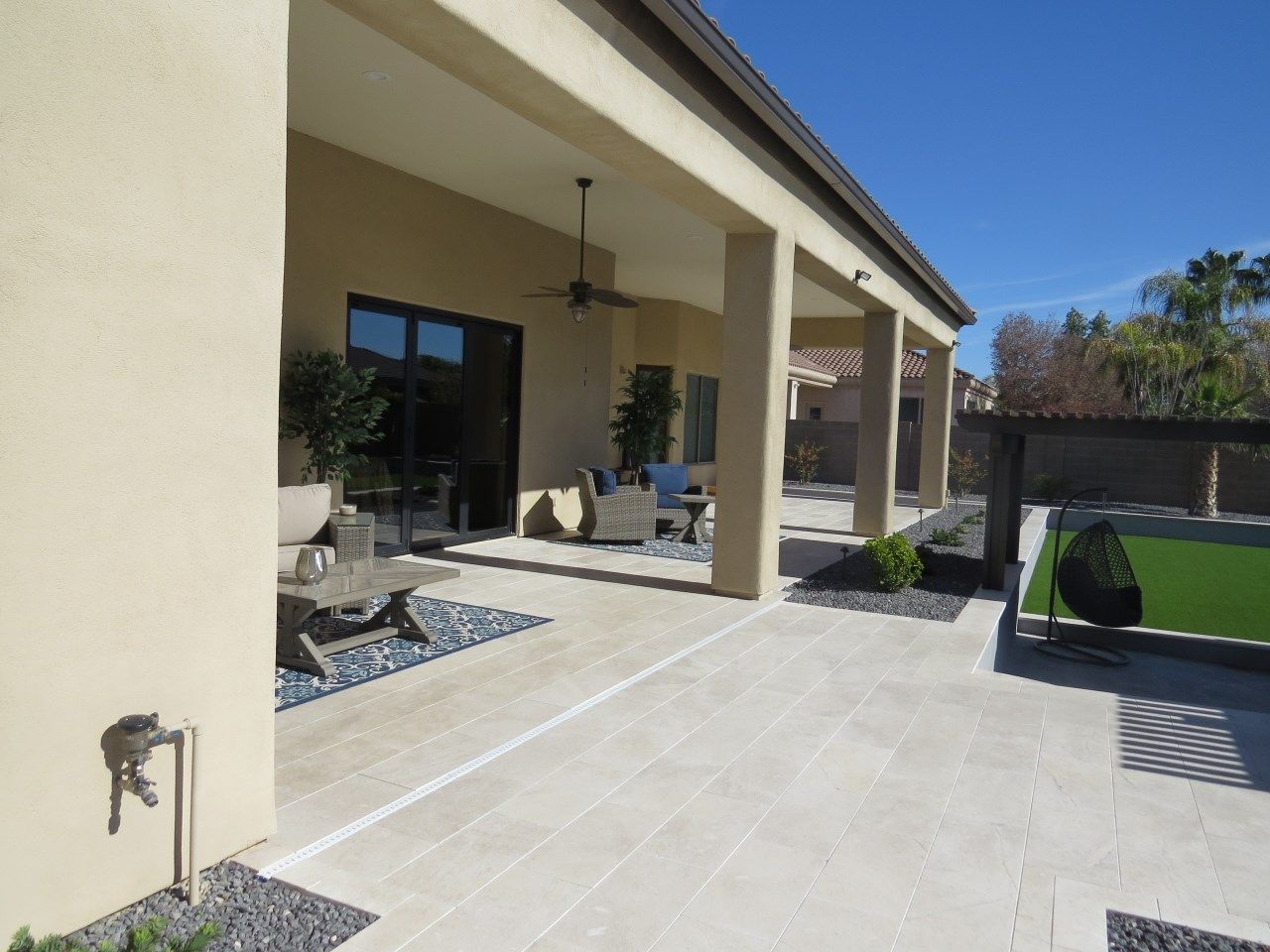 The backyard of a house with a patio and a pool
