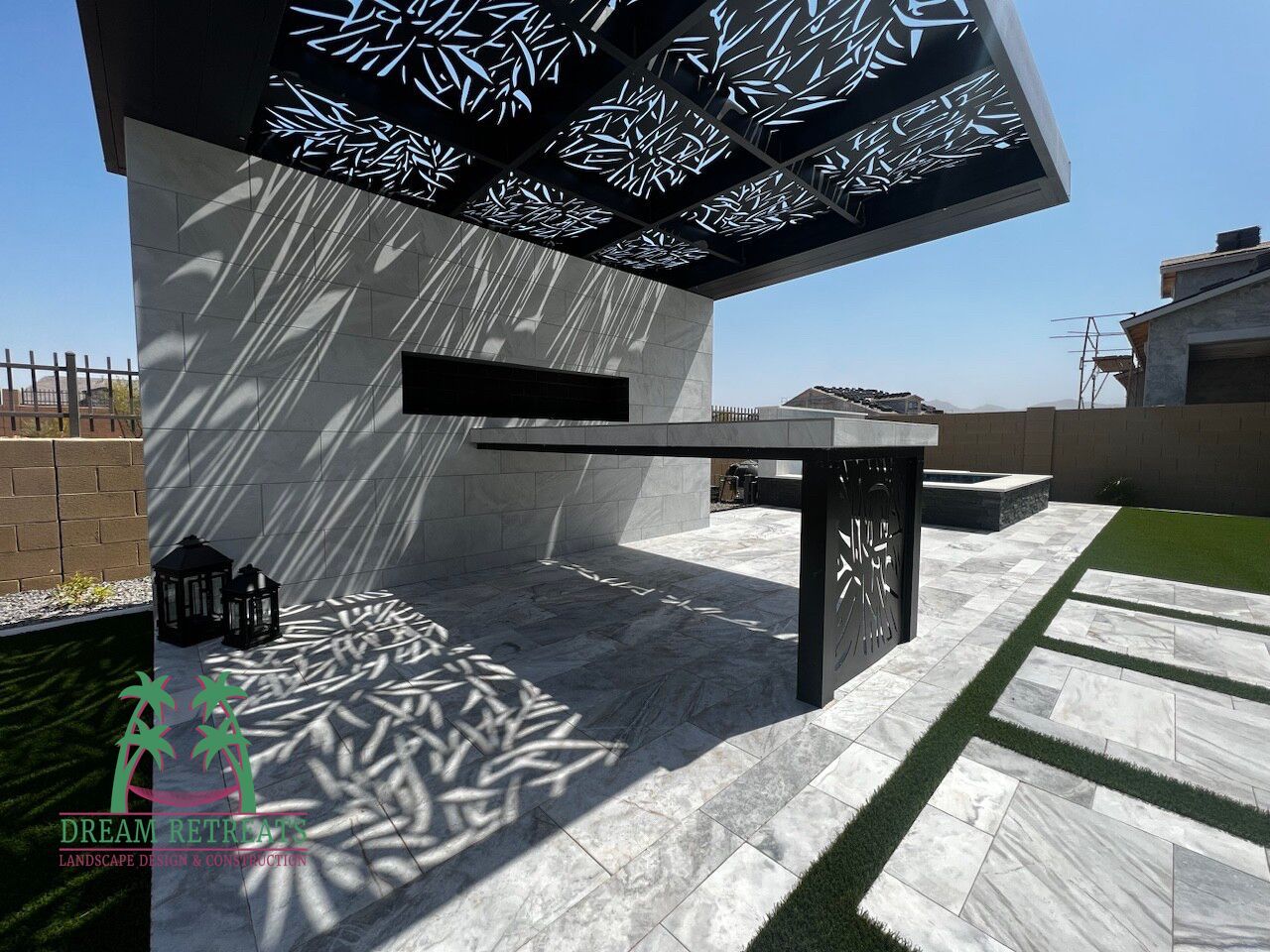 A patio with a roof that has a pattern on it