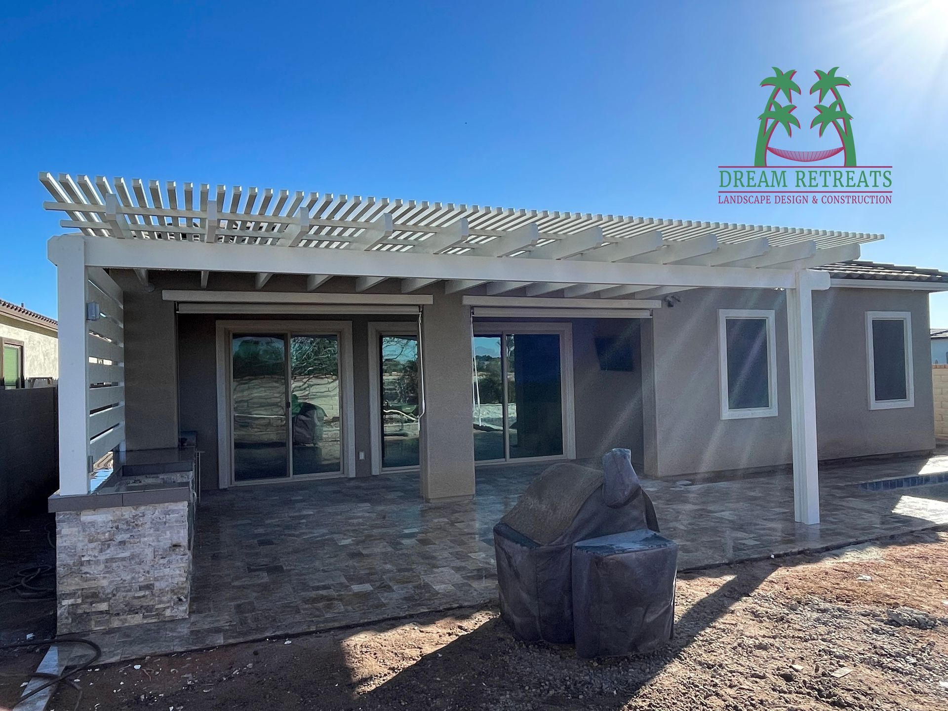 A house with a pergola on top of it