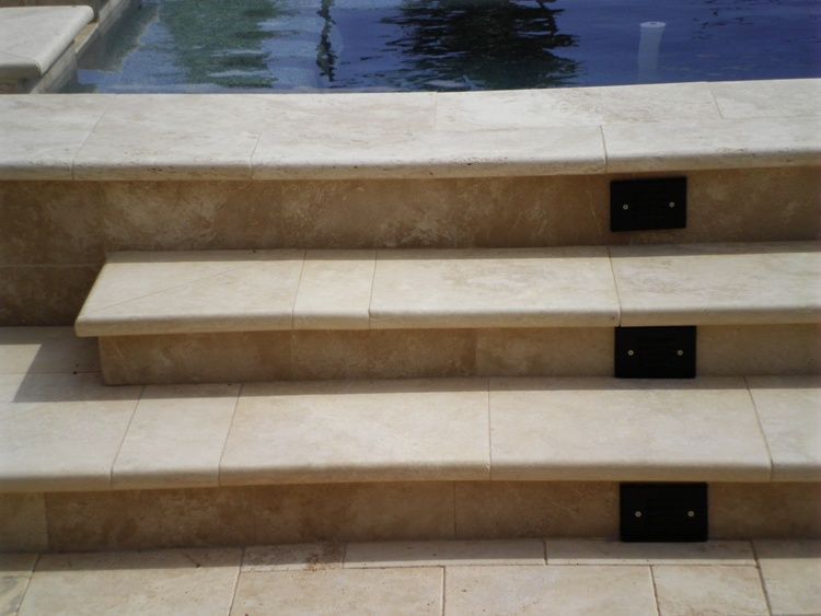 A set of stairs leading up to a pool