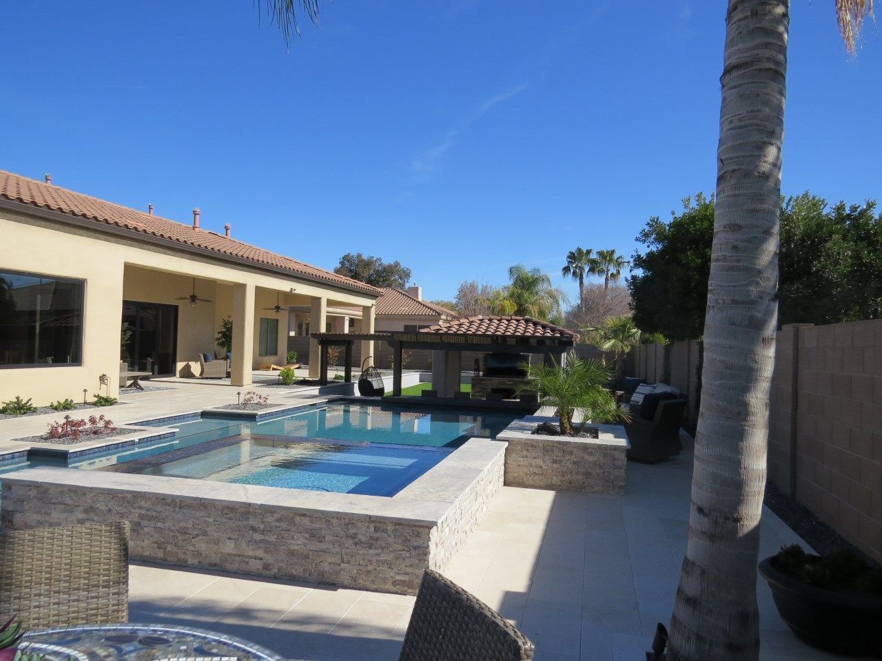 A large house with a swimming pool in the backyard