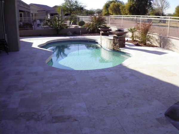 A large swimming pool with a fence around it