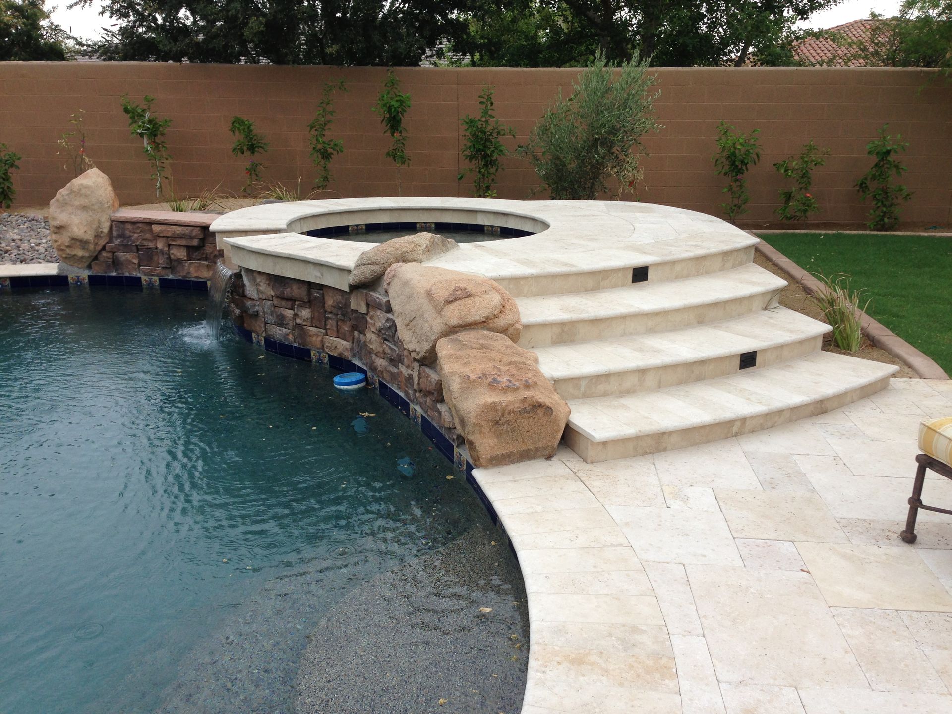 A swimming pool with stairs leading up to it