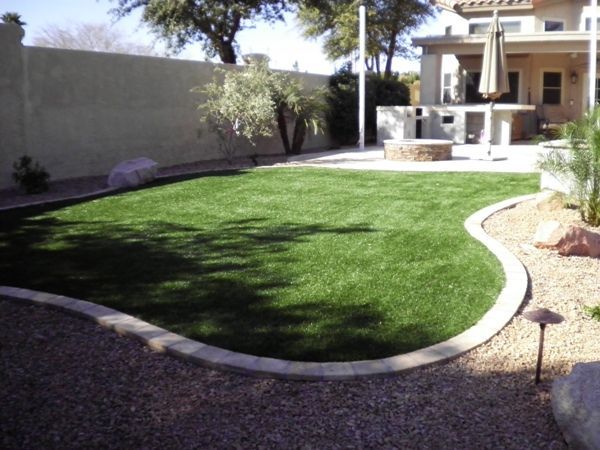 A lush green lawn in front of a house