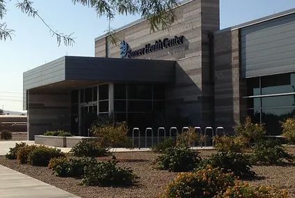 A large building with a sign that says american health center