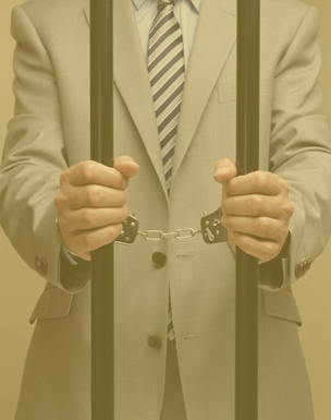 Man in cell with handcuffs