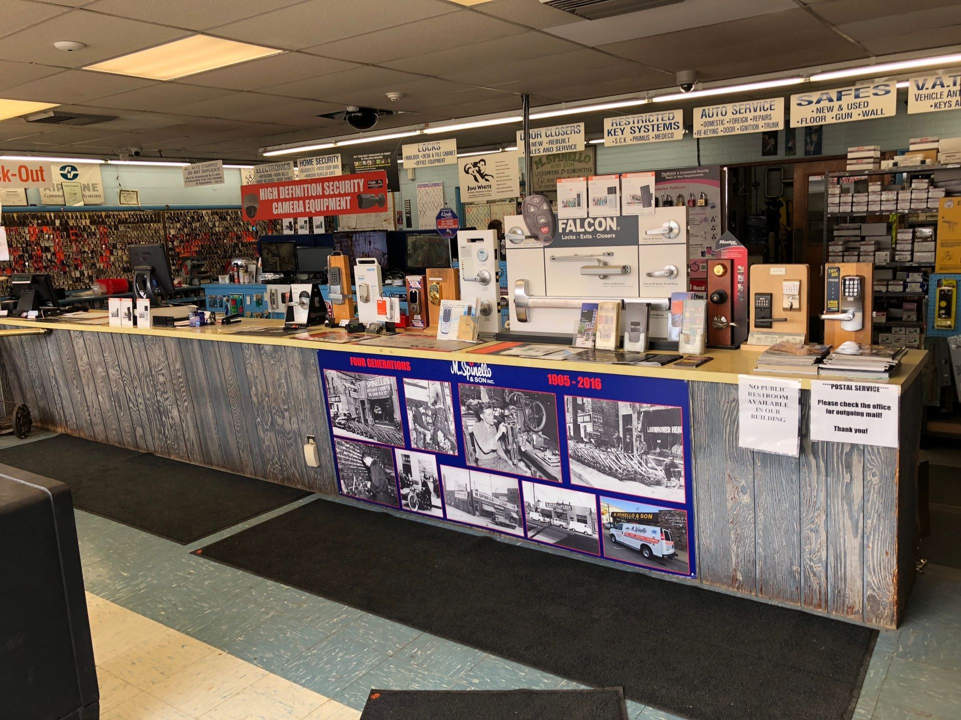 Interior of a hardware store with a long counter displaying various products.