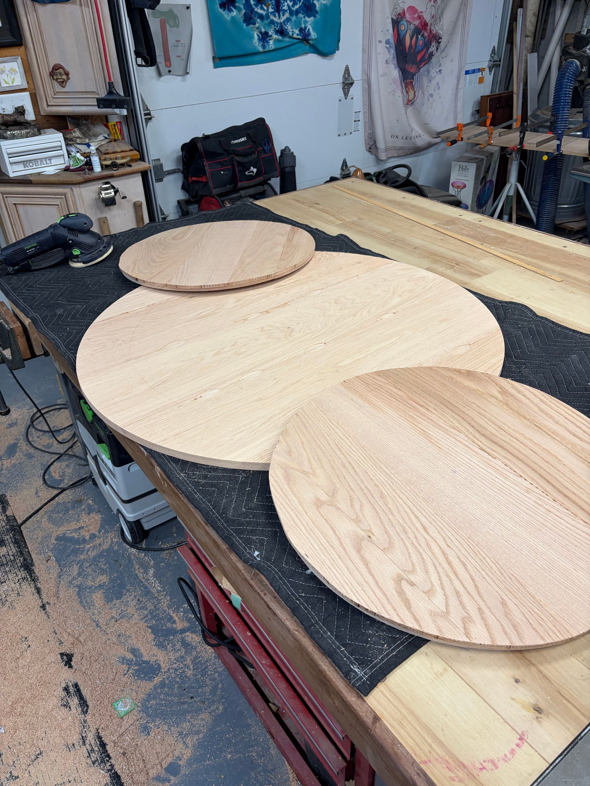 Three circular tables on a workshop.