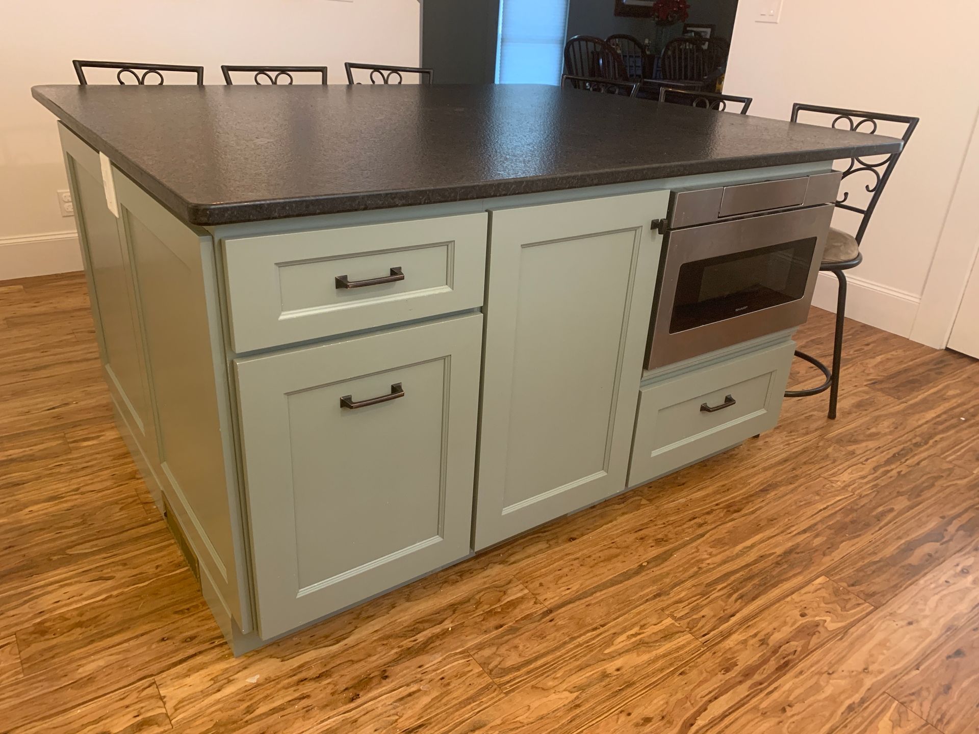 a kitchen with a large island in the middle of it