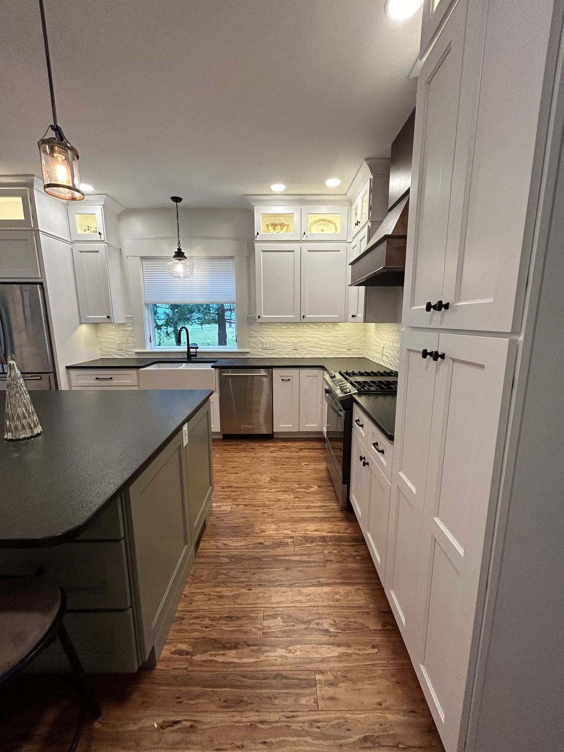 a kitchen with a large island in the middle of it