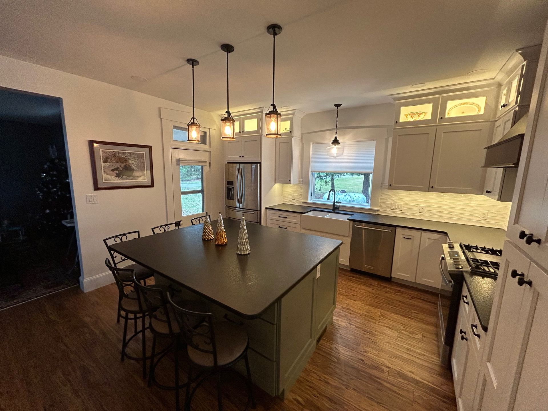 a kitchen with a large island in the middle of it