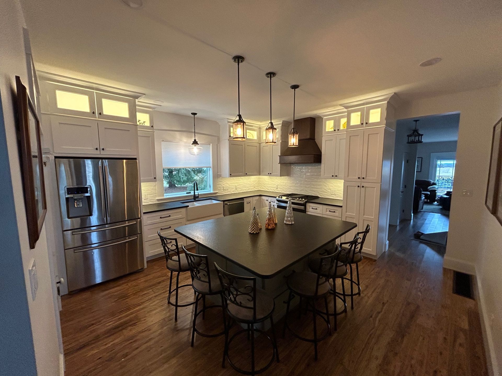 a kitchen with a large island in the middle of it
