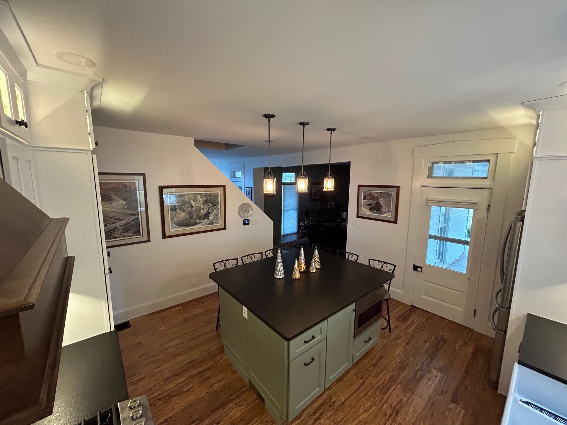 a kitchen with a large island in the middle of it