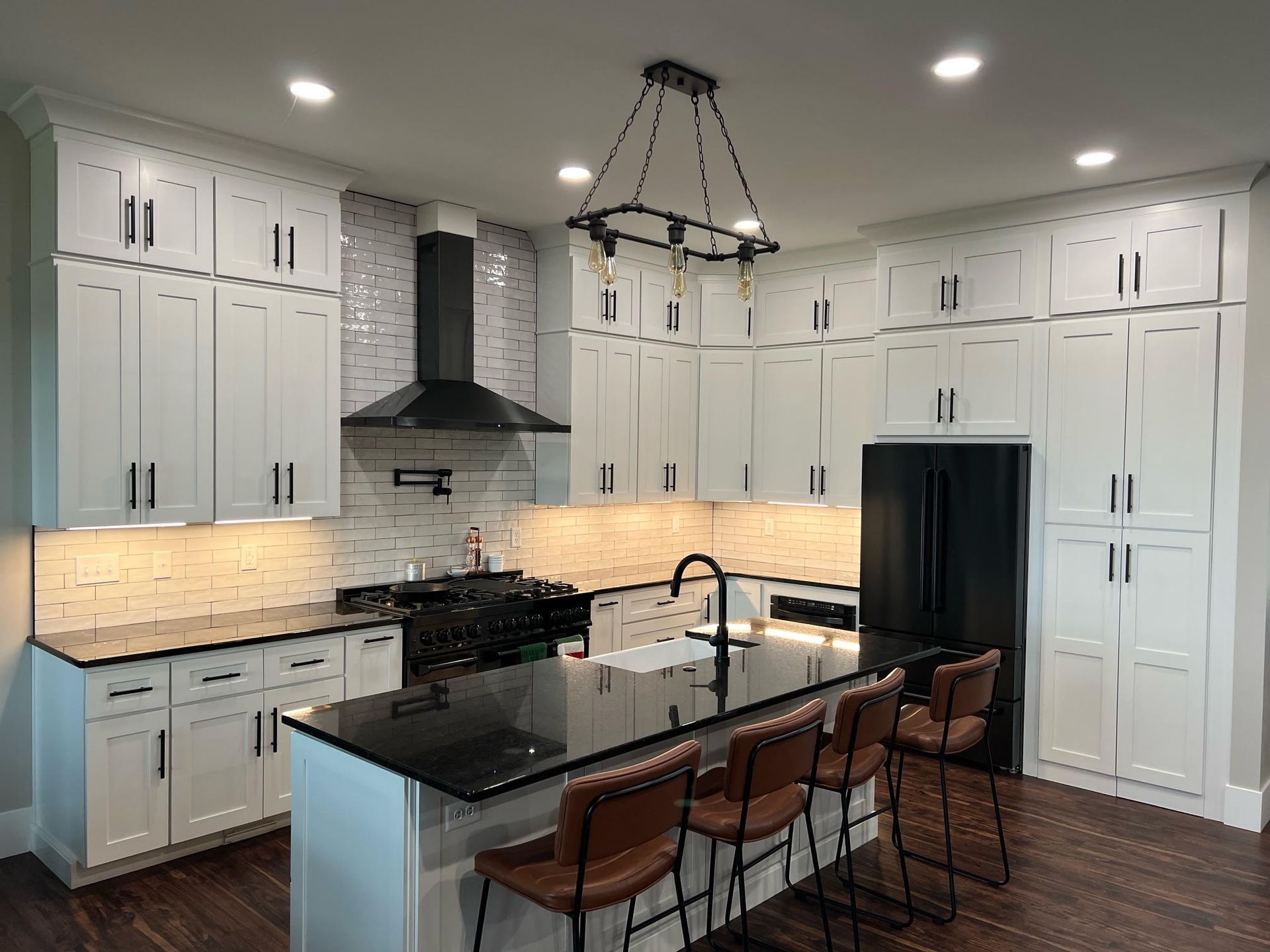 Kitchen with white cabinets and island
