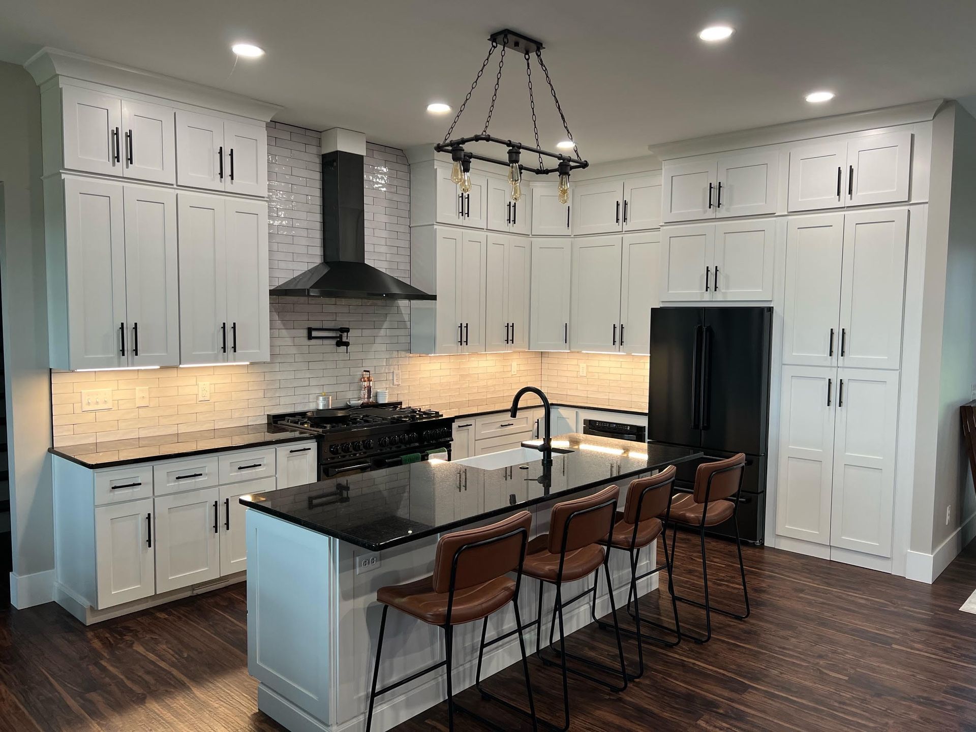 Kitchen with white cabinets and island countertop