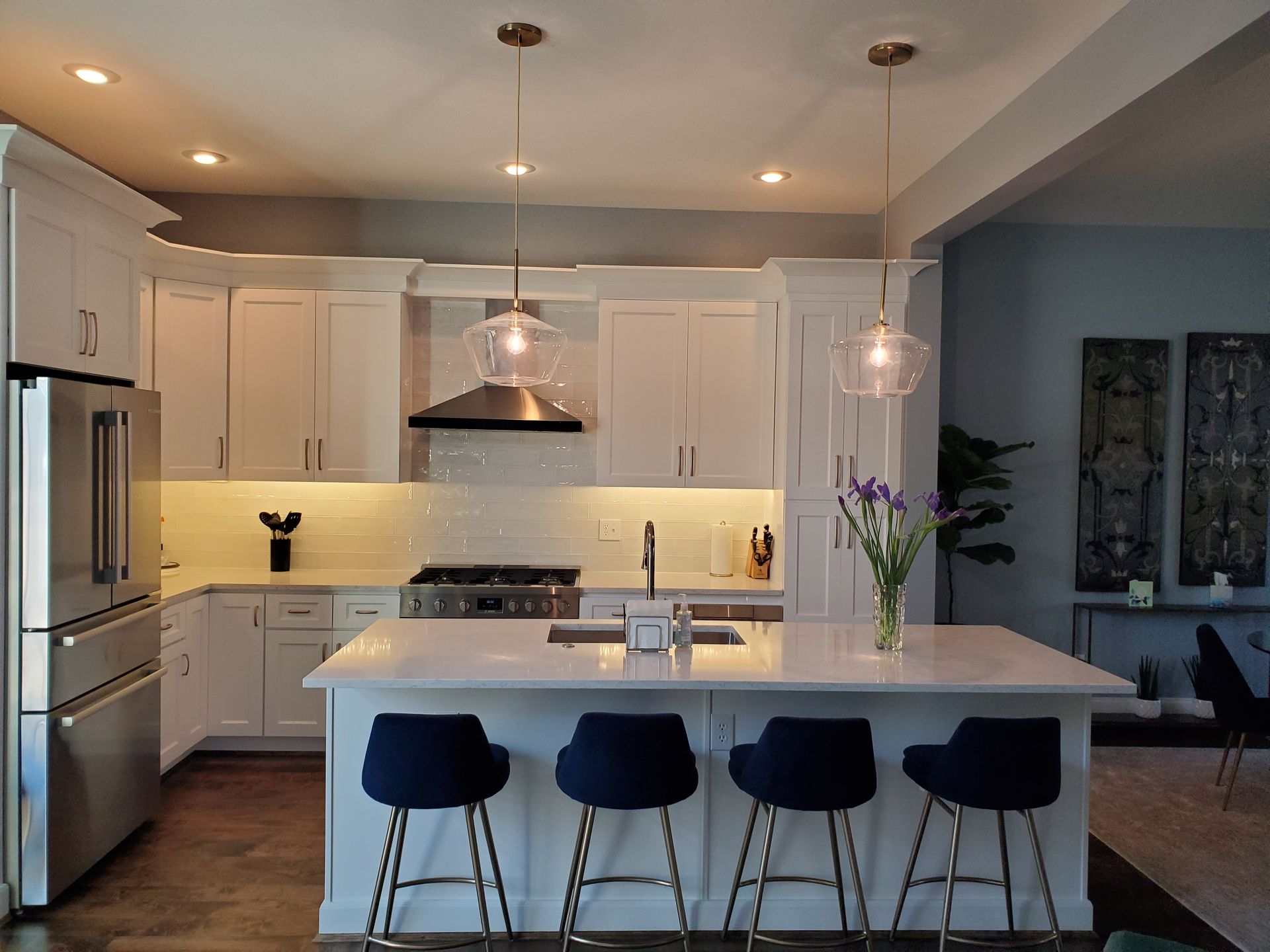 Kitchen with white cabinets and island