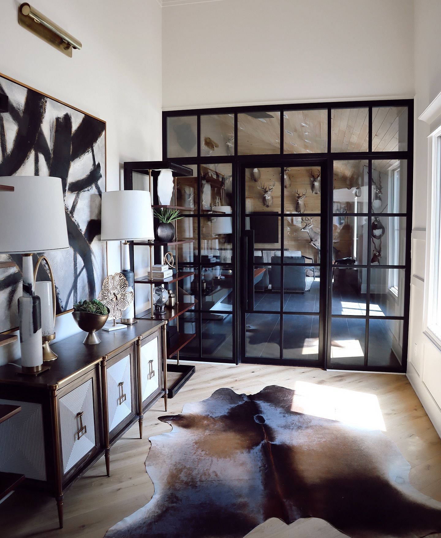 A living room with a cowhide rug on the floor
