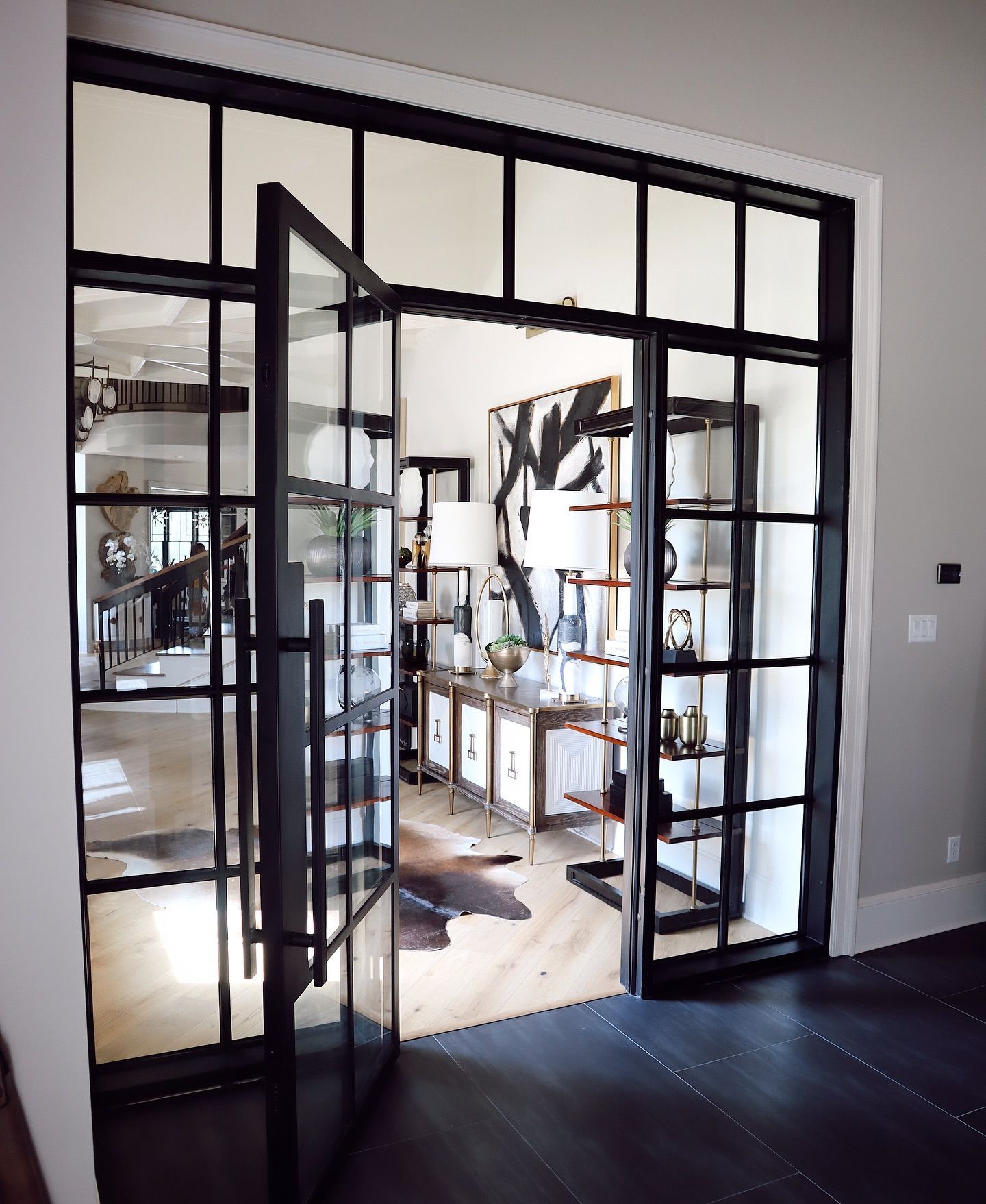 A room with a sliding glass door that is open