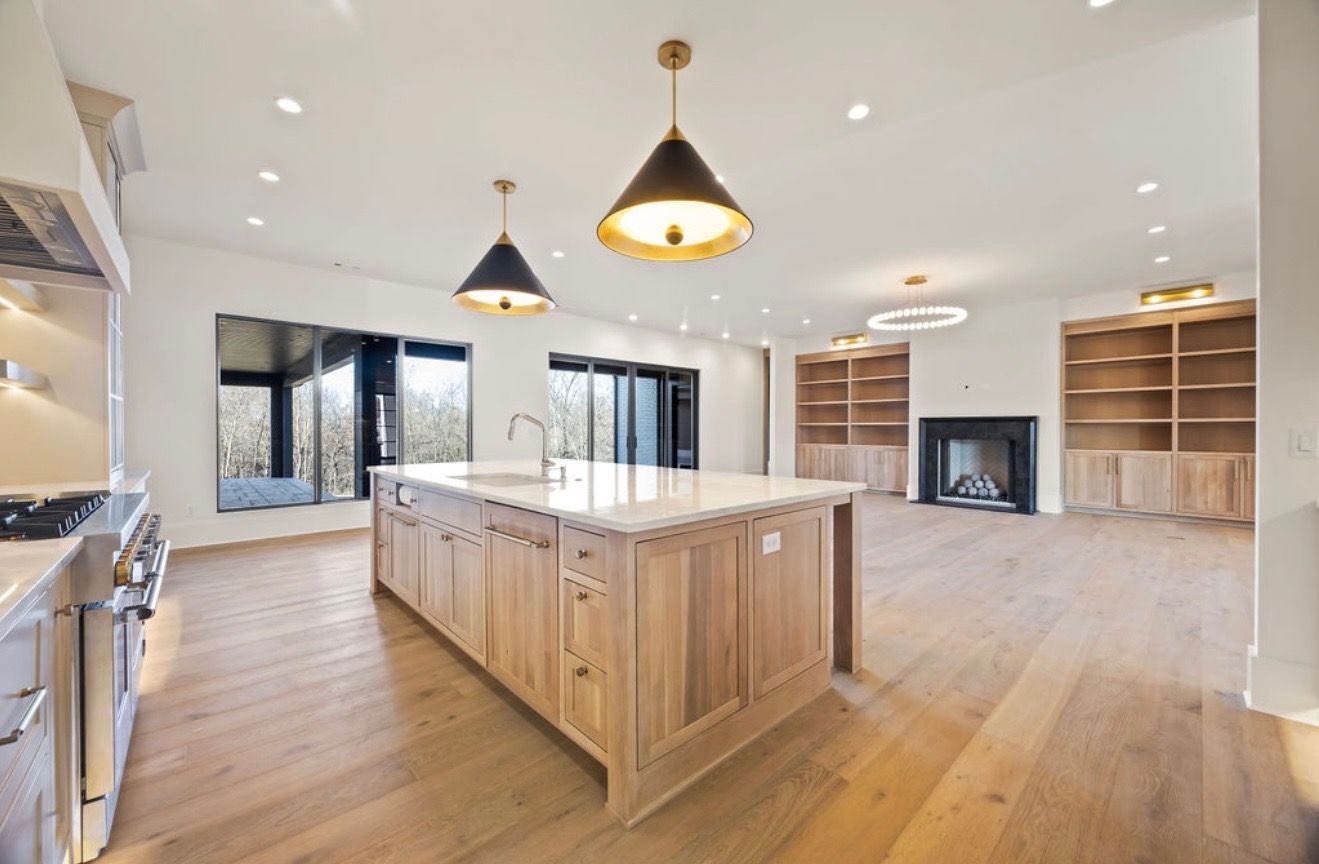 There is a large island in the middle of the kitchen.