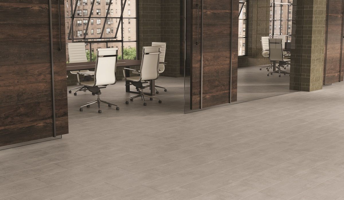 Conference rooms with open doors, brown wood panels, light gray floors.