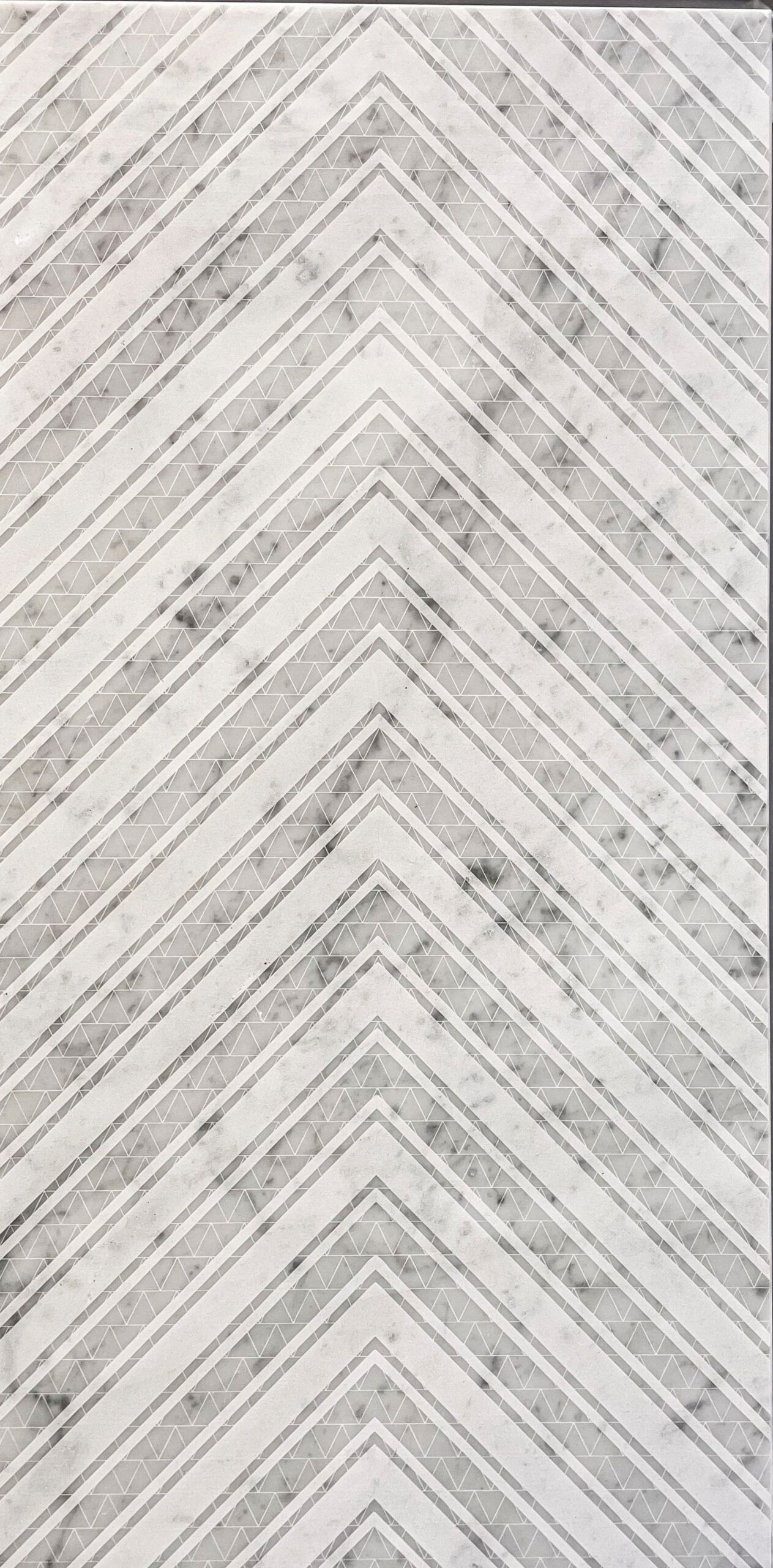 White and gray chevron pattern on a rectangular surface.