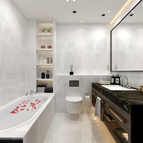 Modern bathroom with a bathtub, toilet, sink, and shelving unit. White and black tones.