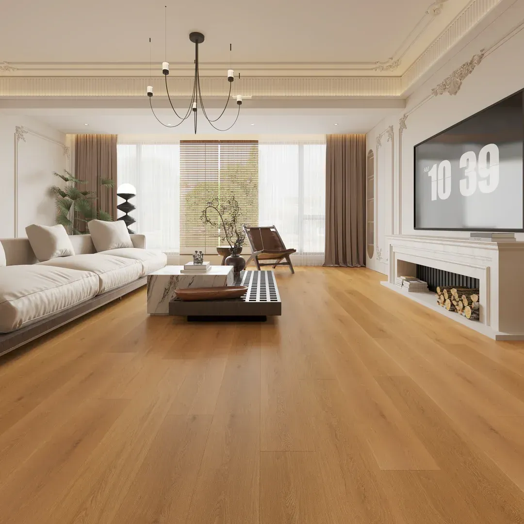 Living room with hardwood floors, a white sofa, and a large TV.
