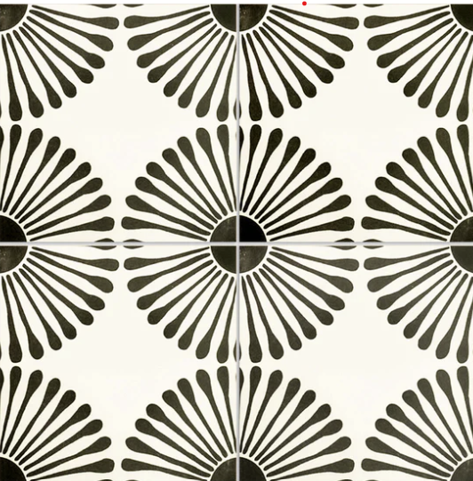 Black and white tile pattern with circular sunburst designs.