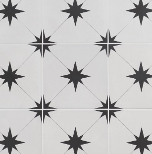White and black starburst patterned tiles forming a repeating design on a surface.