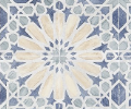 Blue, white, and cream patterned tile with a central floral design and star and geometric elements.