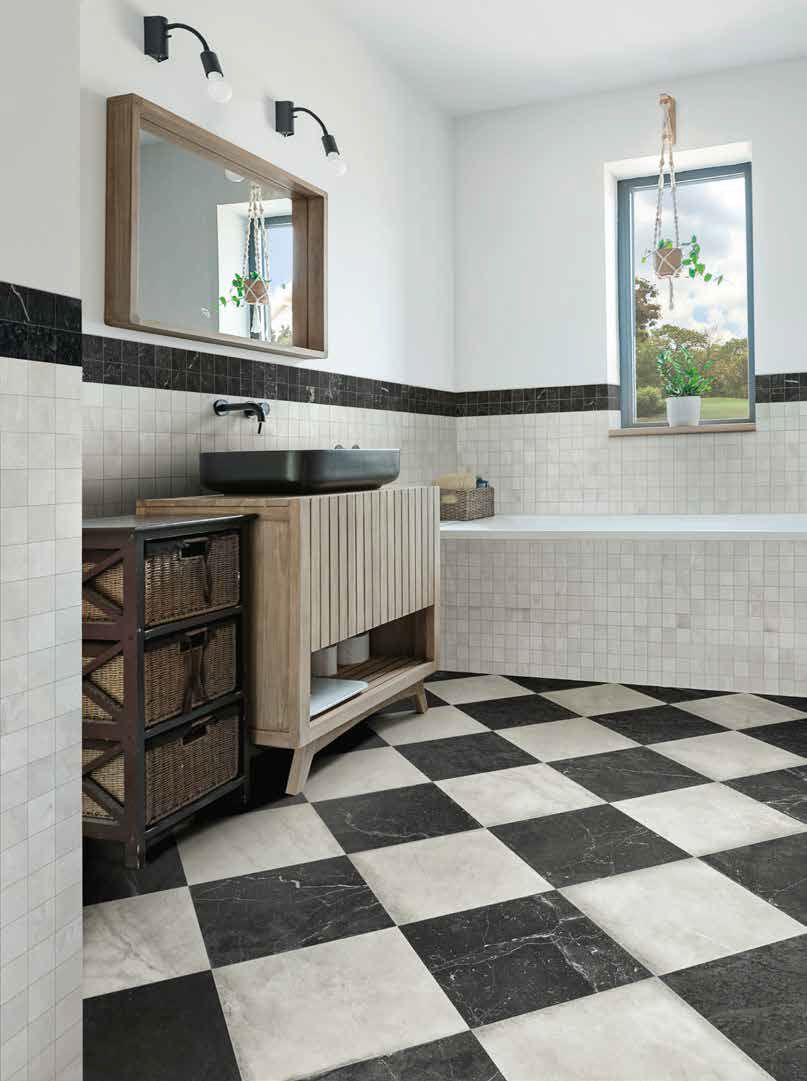 Bathroom with black and white checkered floor, wood vanity, and a small window with plants.