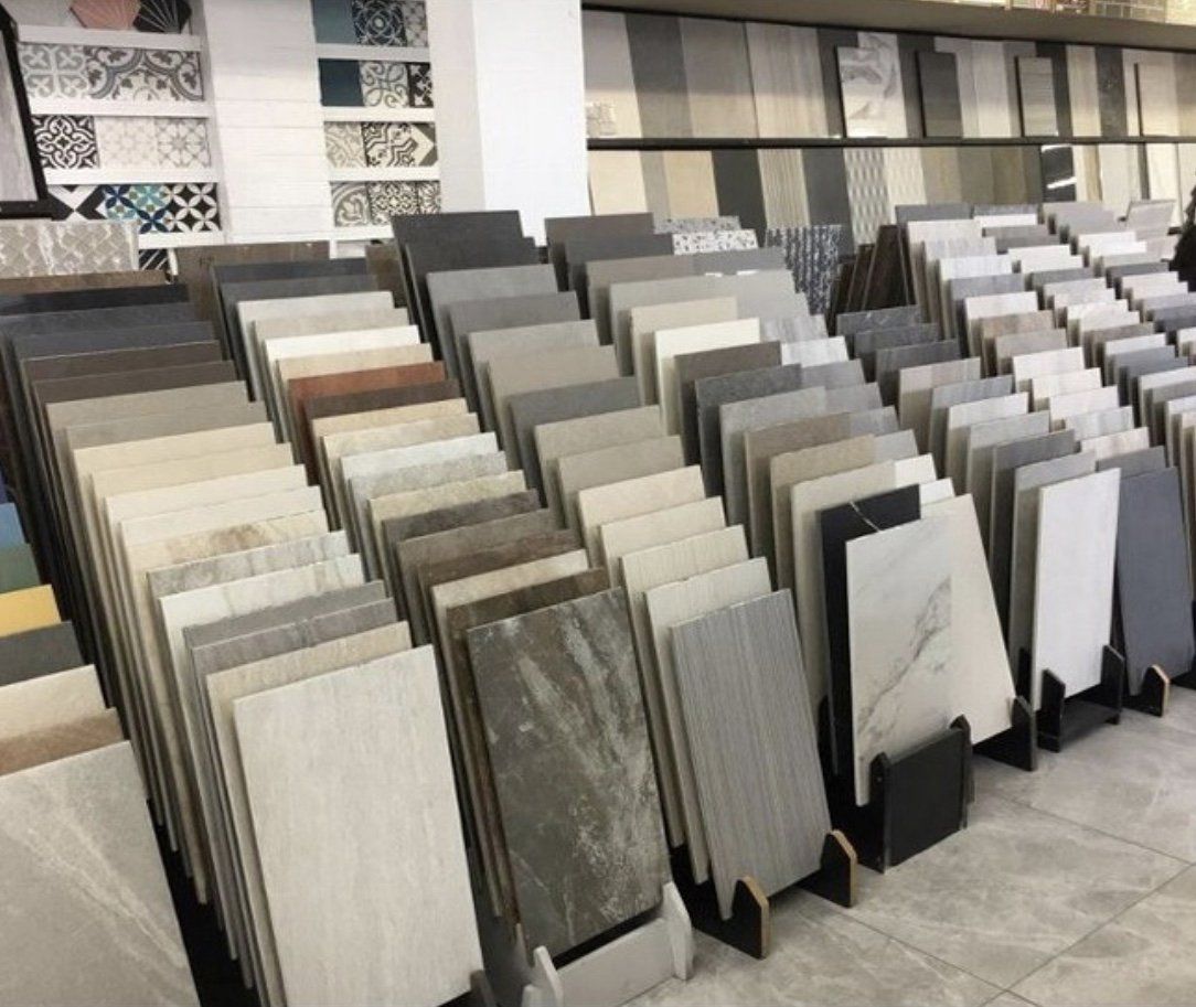 Tile samples displayed in a showroom, showcasing various colors and patterns.