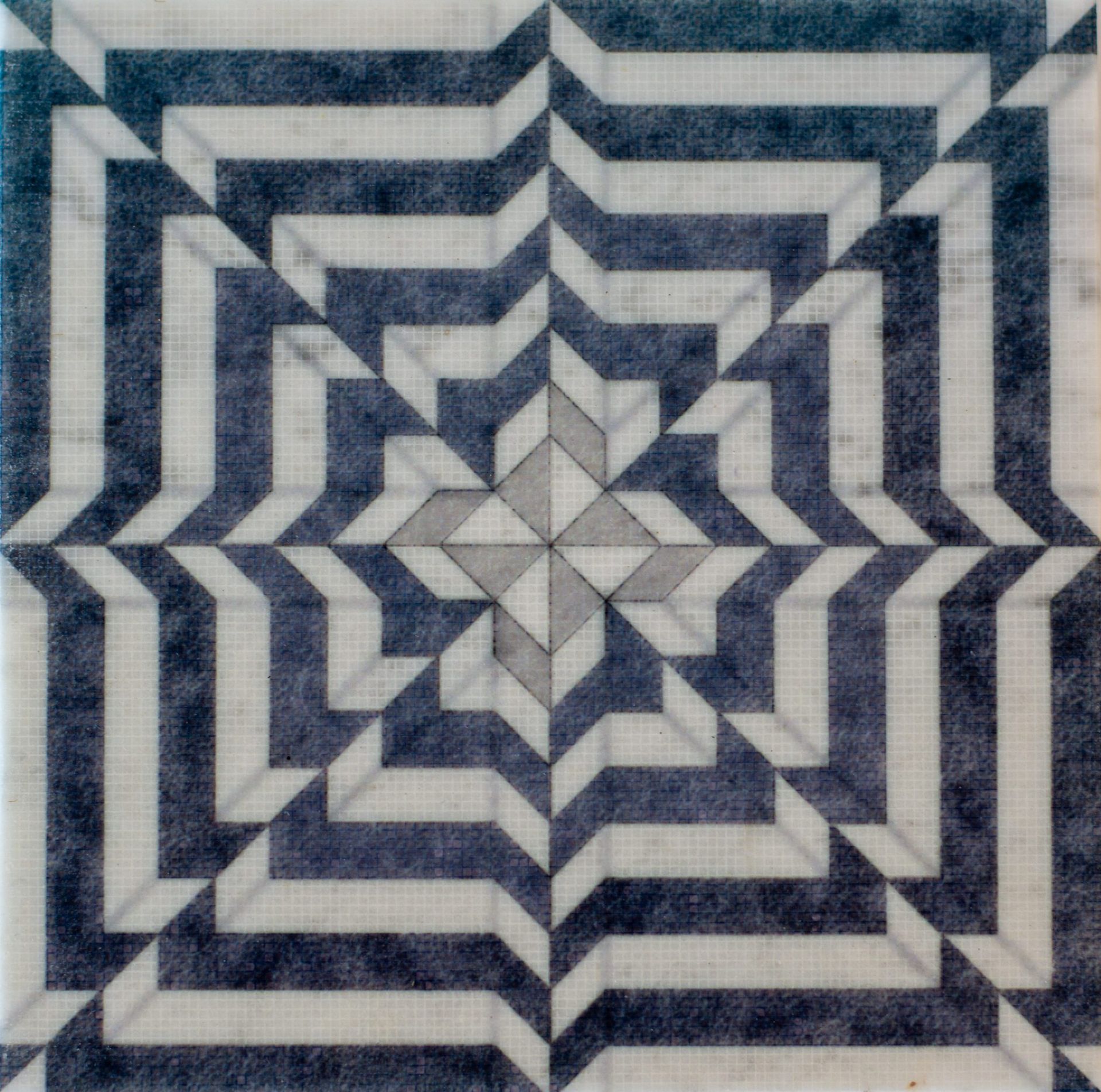 Geometric tile design with blue and white striped patterns radiating outward.