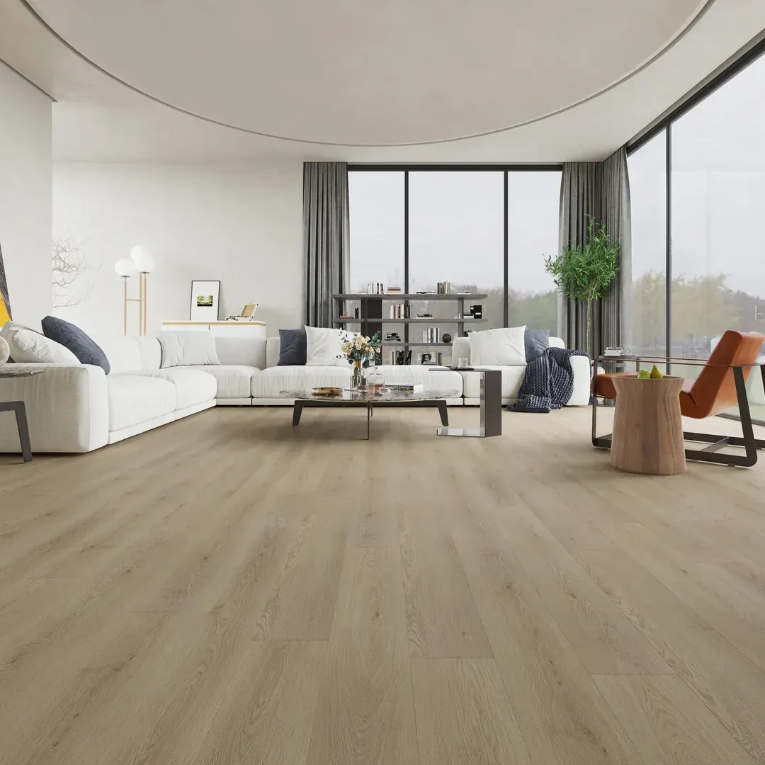 Modern living room with light wood flooring, white furniture, and large windows overlooking a foggy landscape.