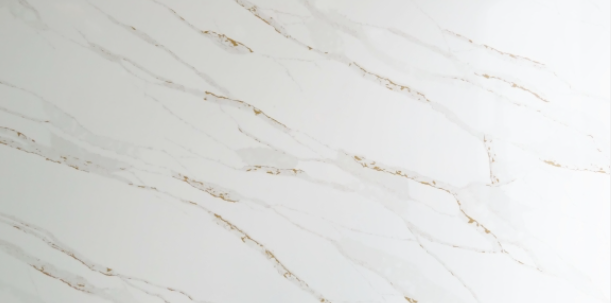 White marble surface with gold veining.