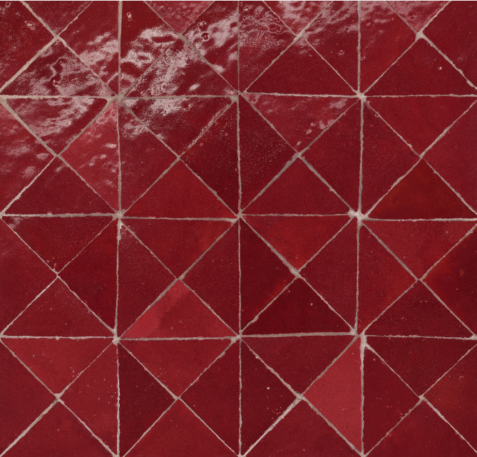 Red diamond-patterned tile floor with white grout lines.