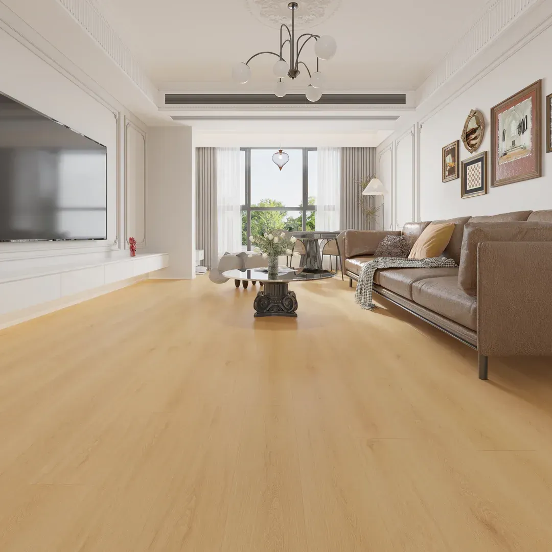 Spacious living room with light wood floors, leather sofa, and a TV; a view of an outdoor scene is through the windows.