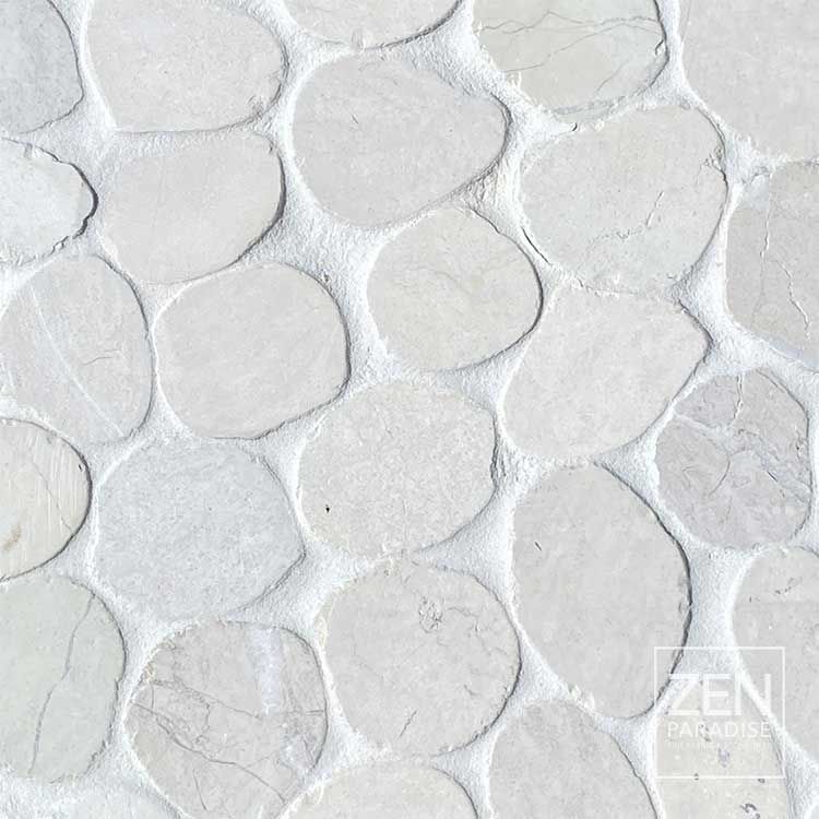 Close-up of white pebble mosaic tile.