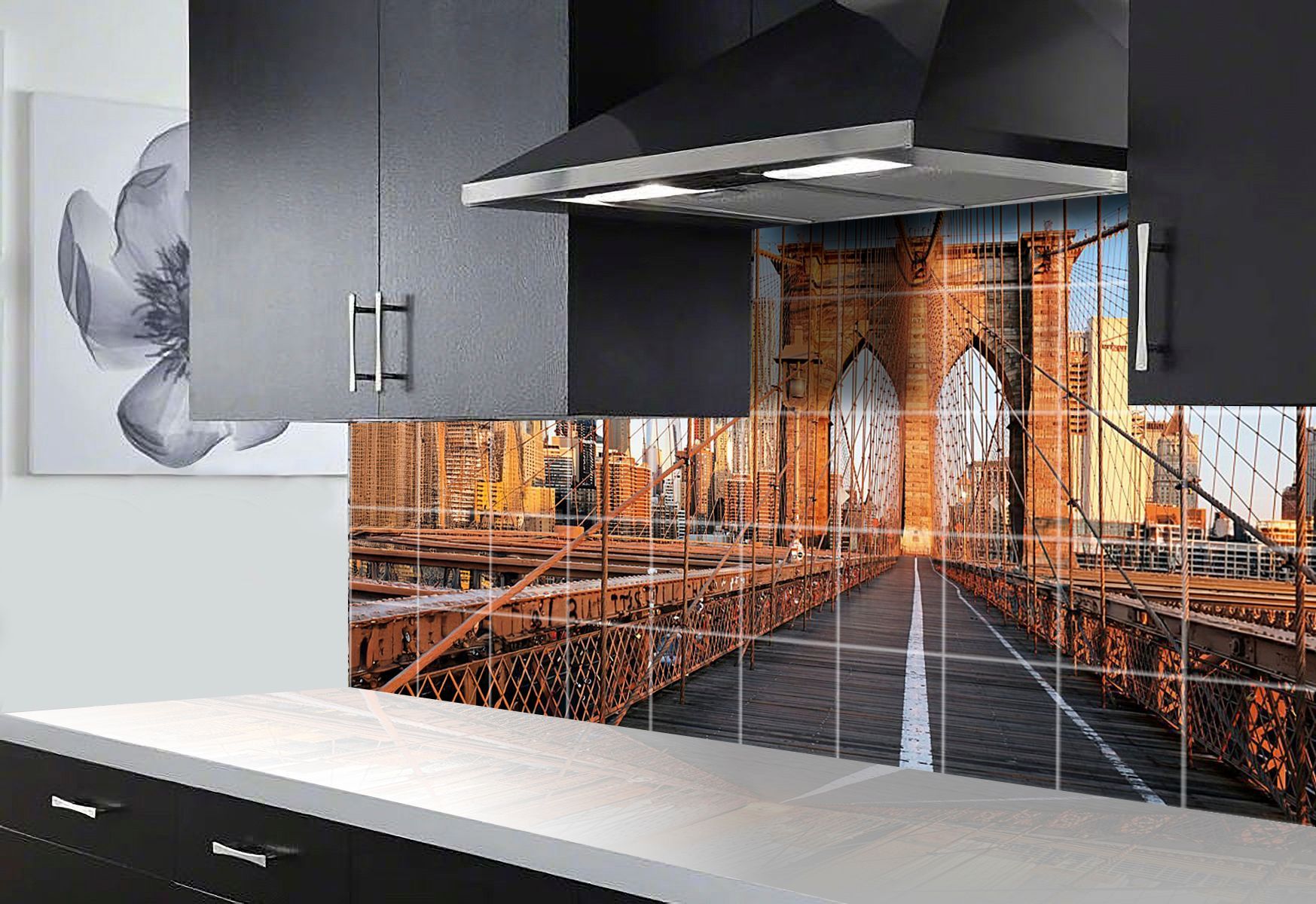 Kitchen backsplash featuring the Brooklyn Bridge, contrasting with black cabinets and white countertop.