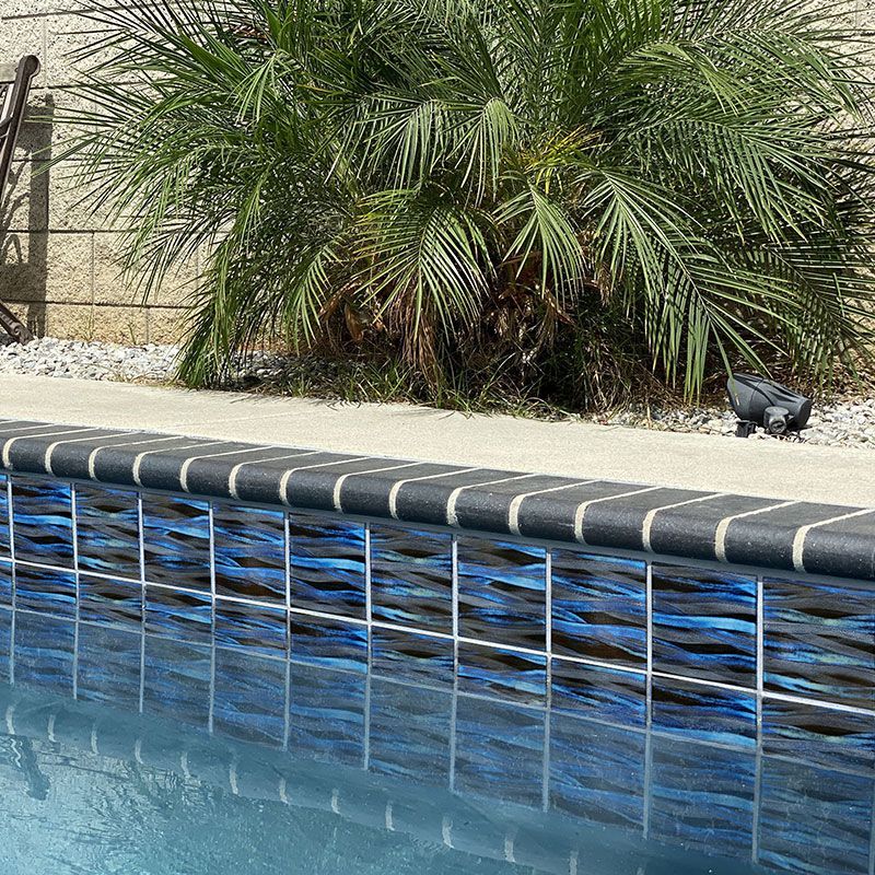 Kawa Pool Tile from FUJIWA Tile, featuring a sleek, contemporary design with deep blue and green tones, perfect for enhancing pool and spa areas with a stylish and durable finish
