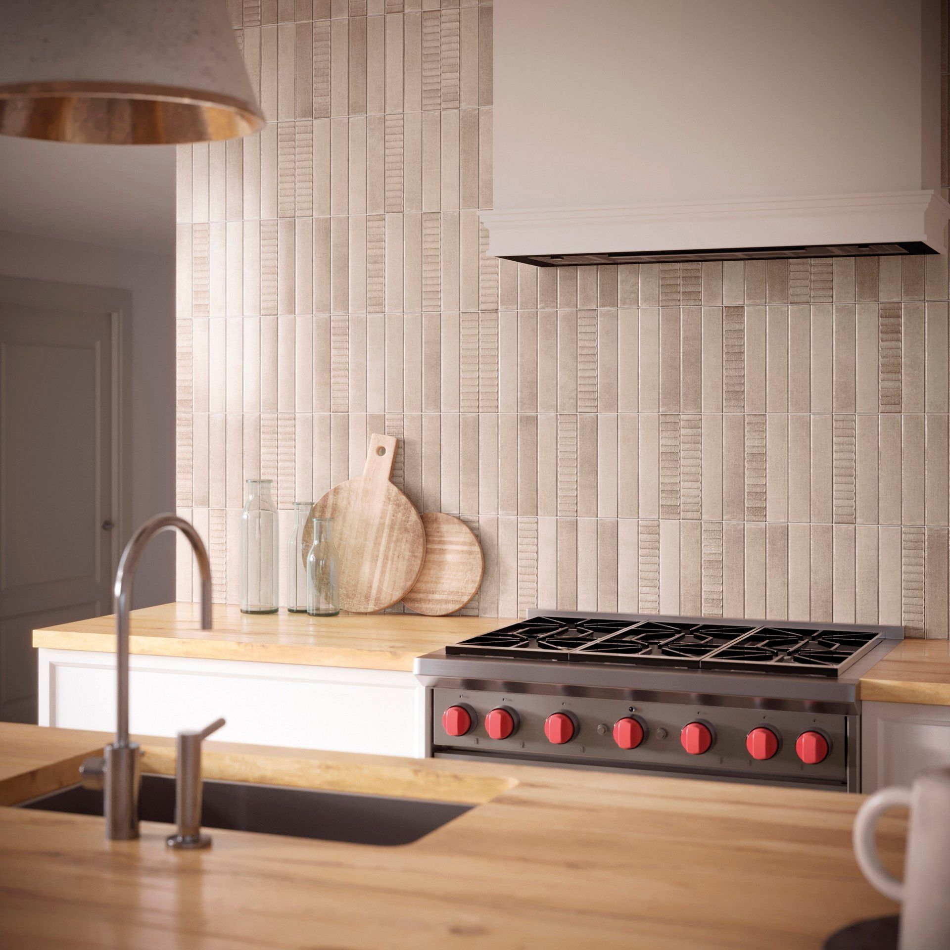 Kitchen with stove, sink, wooden countertops, and light-colored vertical tile backsplash.