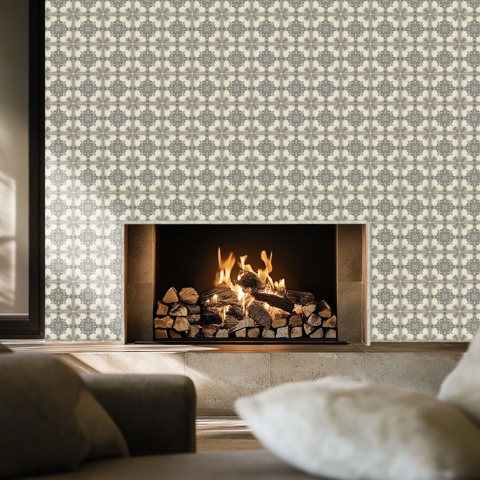 Fireplace with lit fire and patterned tile wall; cozy living room setting.