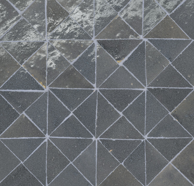 Dark gray diamond tile pattern with white grout lines.