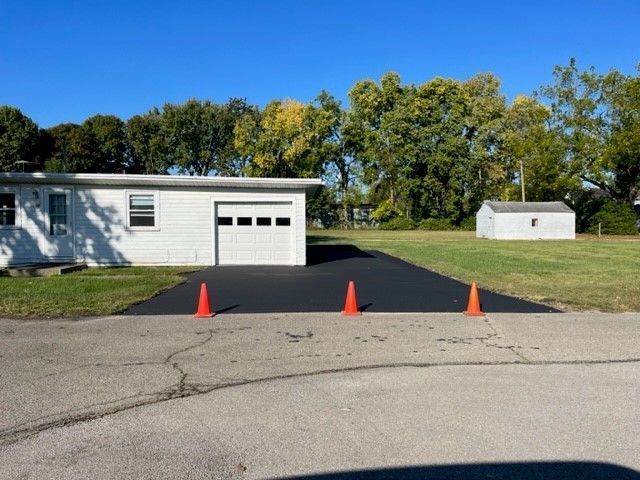 House with newly sealcoated driveway
